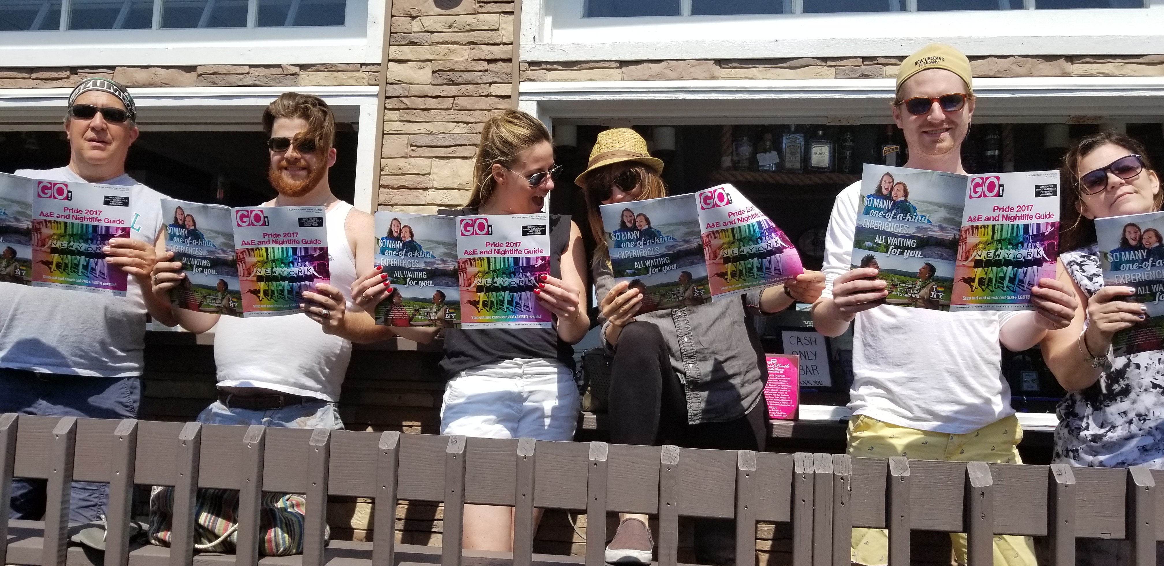 Gays reading GO at Fire Island