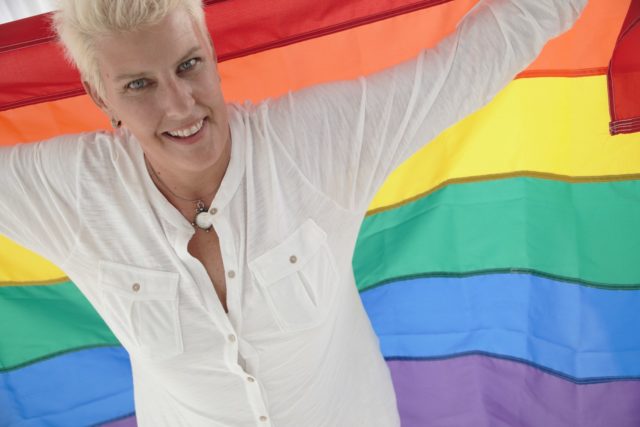 Karen McCrocklin with her rainbow flag
