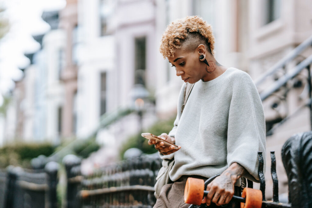 Black woman texting 