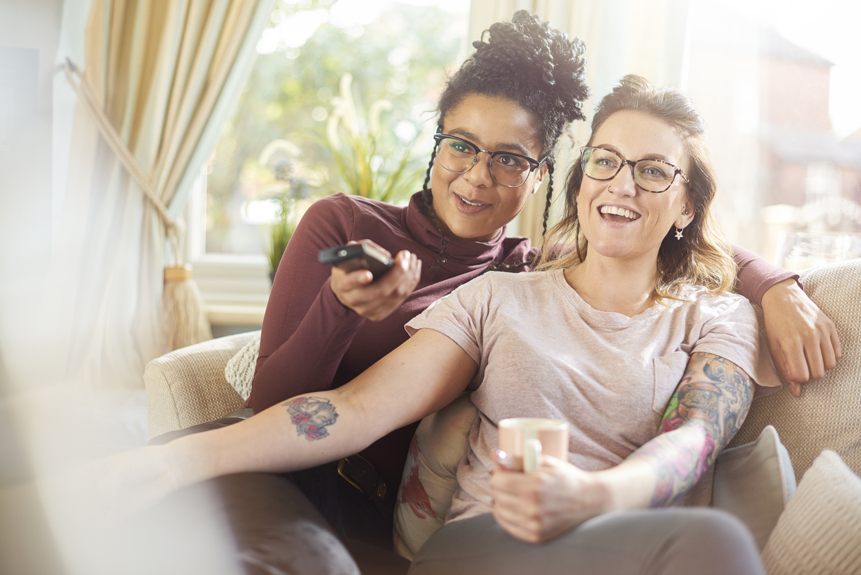 lesbian couple watching a movie