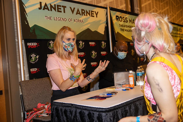 Actress Janet Varney speaks with a fan during Emerald City Comic Con