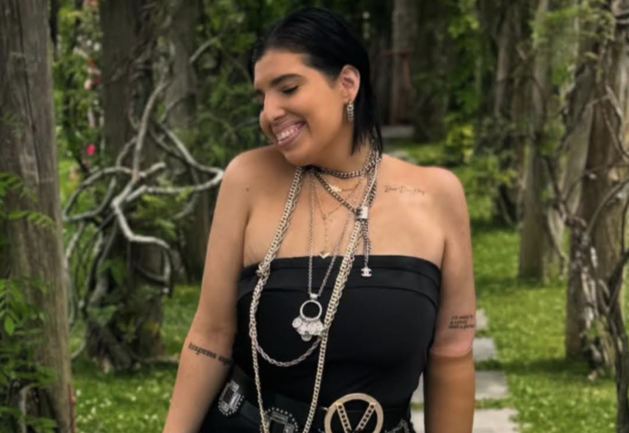 GO Editor Dayna Troisi smiling in a forest