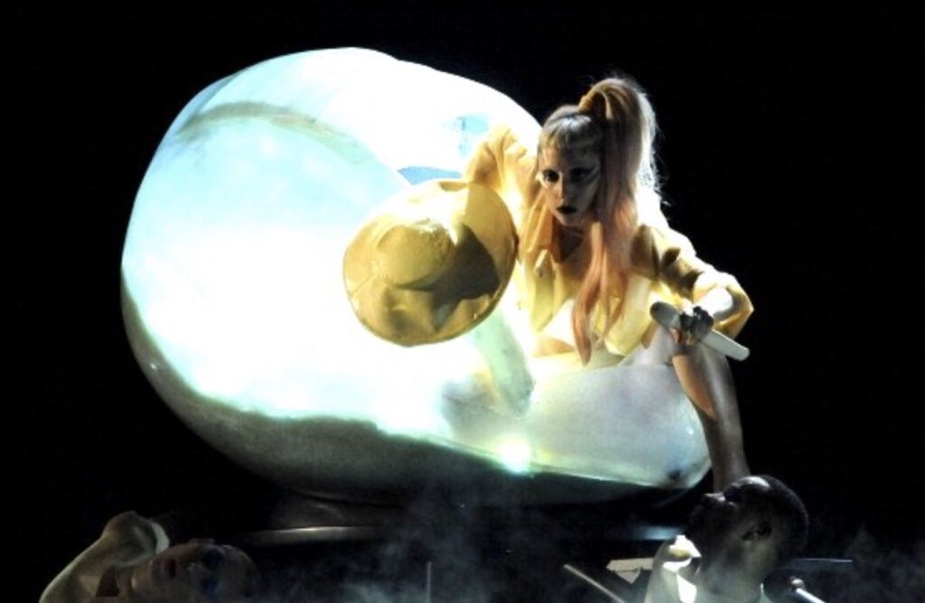 Lady Gaga emerges from an egg at the 2011 Grammys