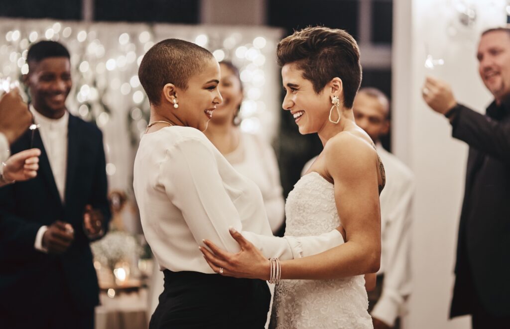 Photo of joyous lesbian couple at their wedding