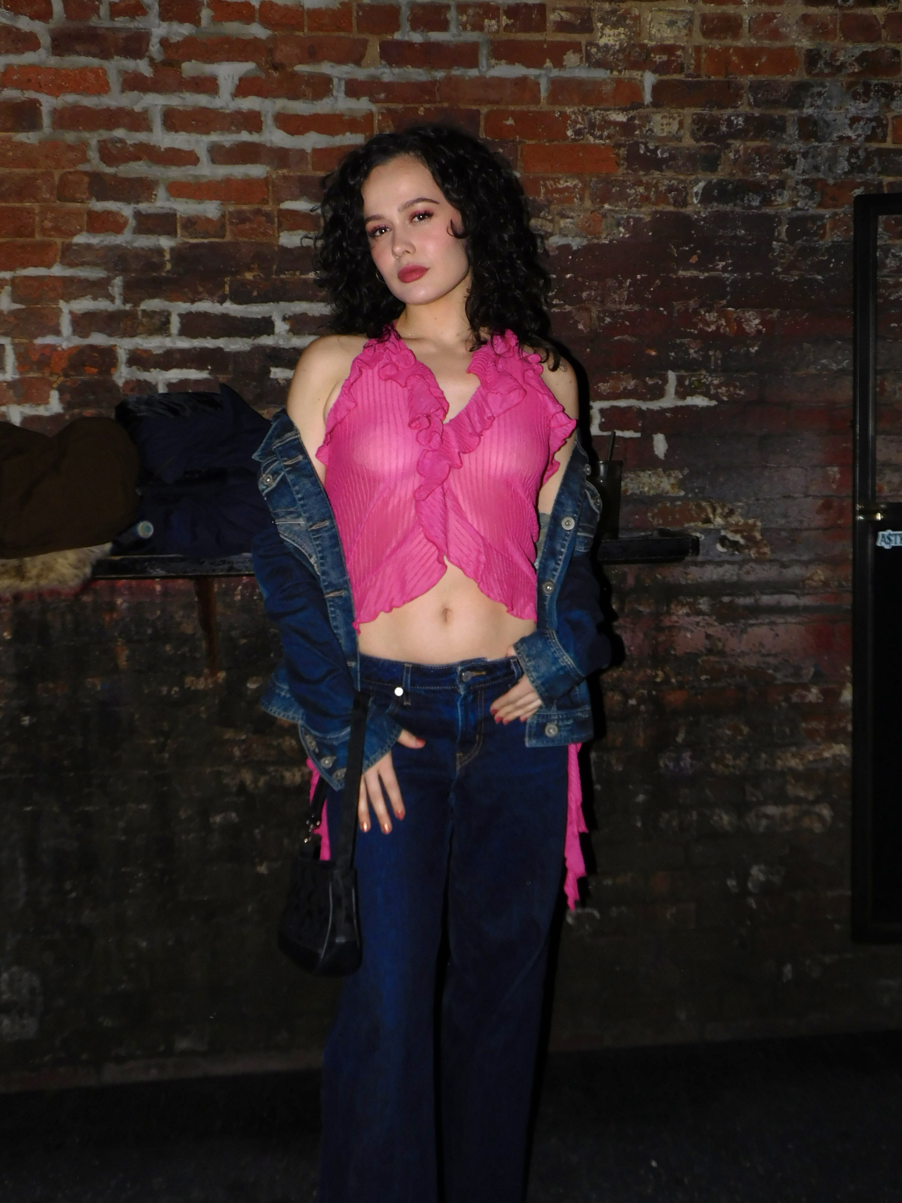 Bianca in pink top and blue jeans