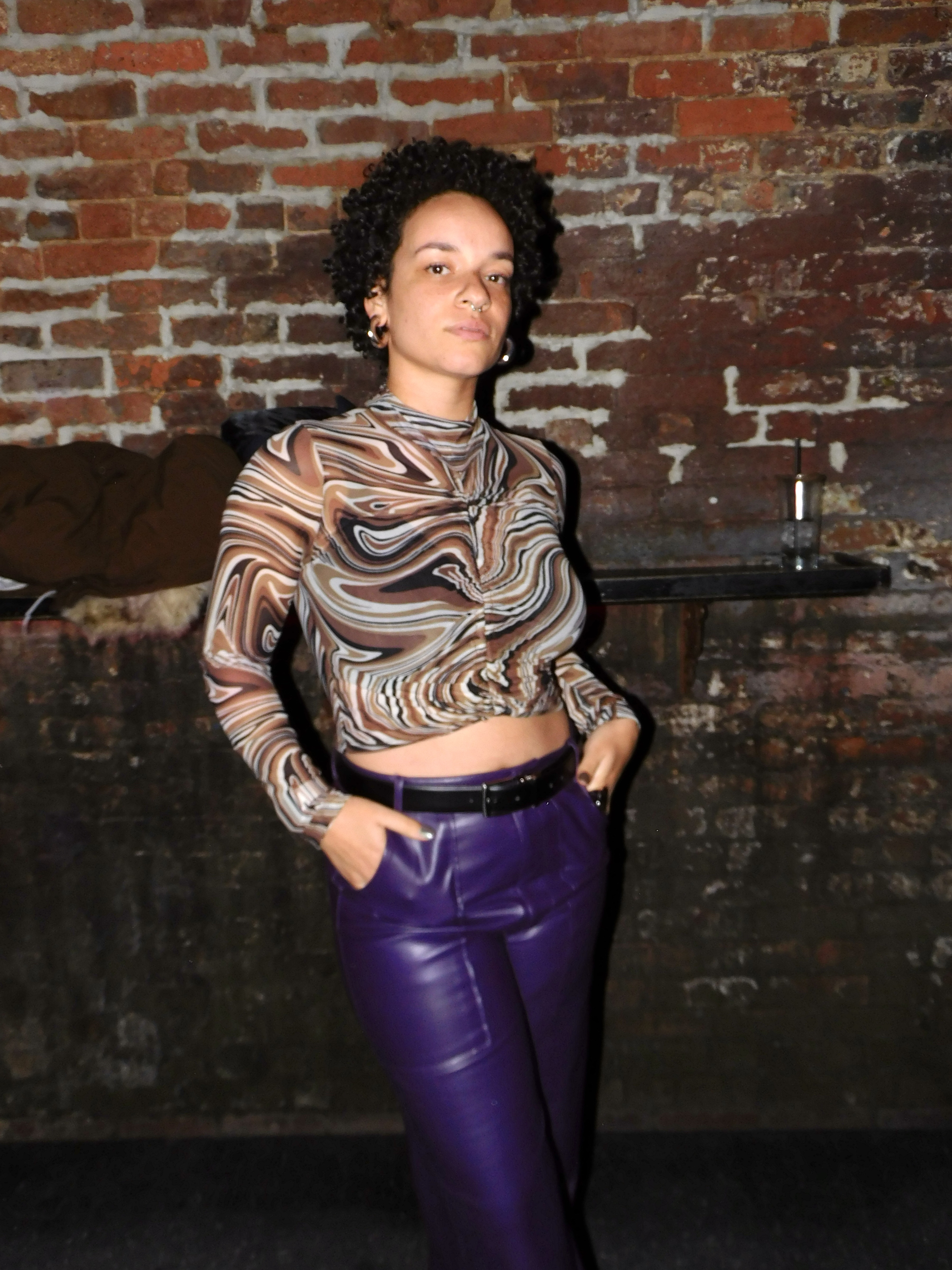 Morgan in a sheer top and purple pants