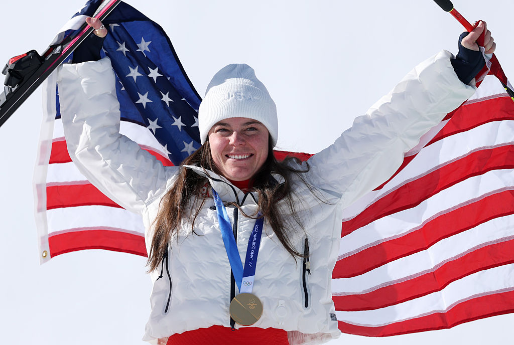 GO-lympic Recap: Bisexual Skier Takes USA’s First Gold, USA Women’s Ice Hockey Wins Big, And More