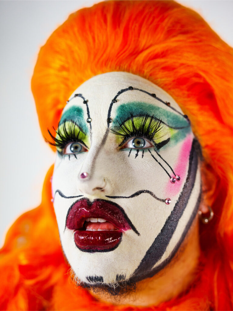 Chase Lounge closeup in orange wig. Photo by @d.r.german courtesy of Chase Lounge