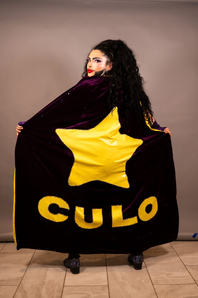 Papi Culo wears a culo cape. Photo by Fifth Eye Media