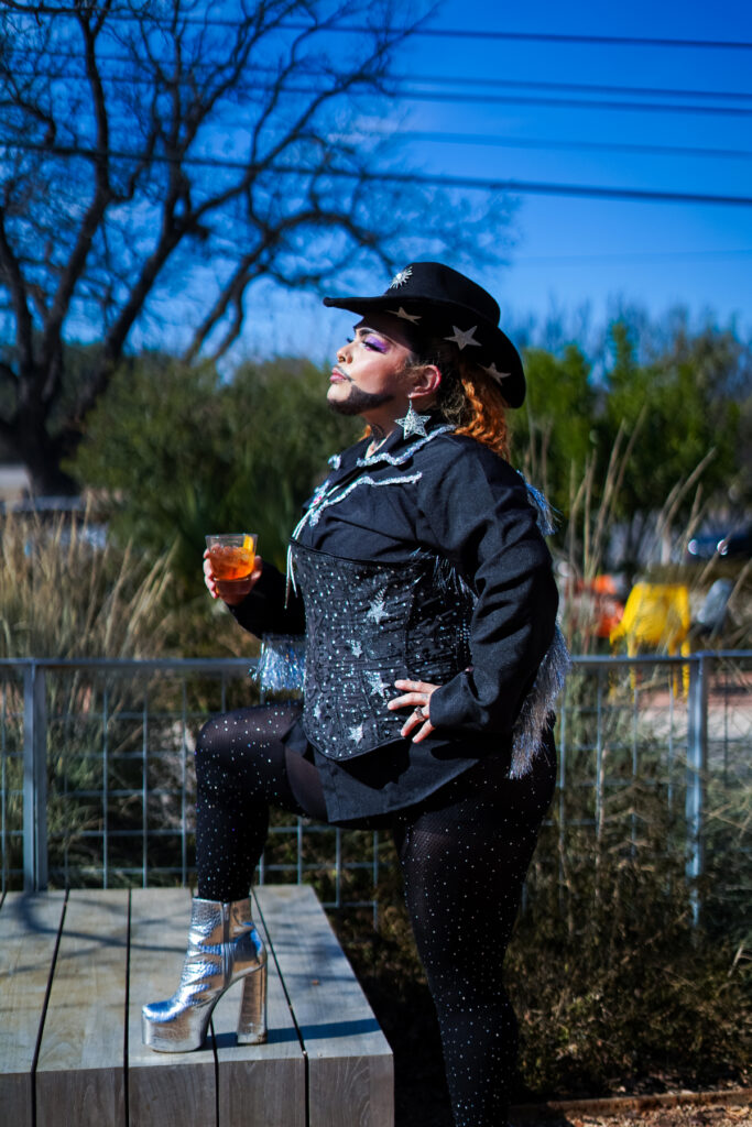 Papi Culo in a cowboy hat and matching outfit. Photo by Fifth Eye Media